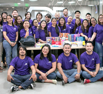 group of ADP associates in purple T-shirts