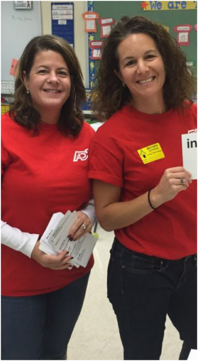 two female ADP associates in red T-shirts
