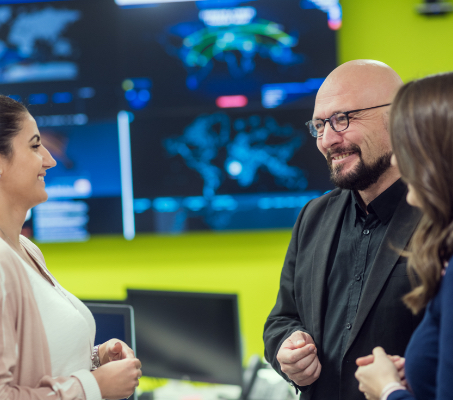 three ADP associates interacting with one another
