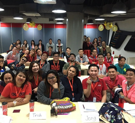 large group ADP Philippine associates seated in a conference room