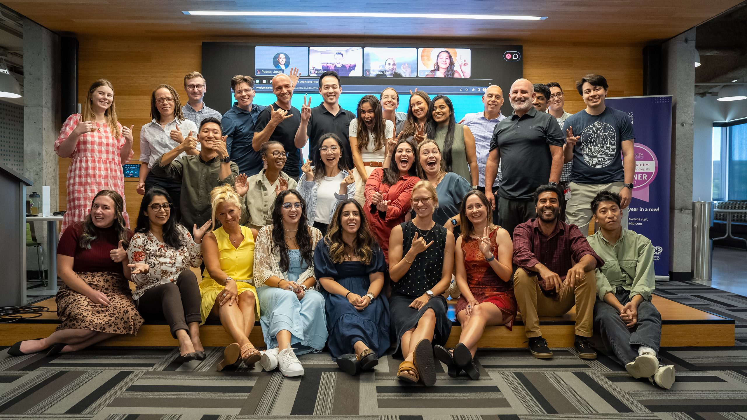 large, diverse group of people with big smiles